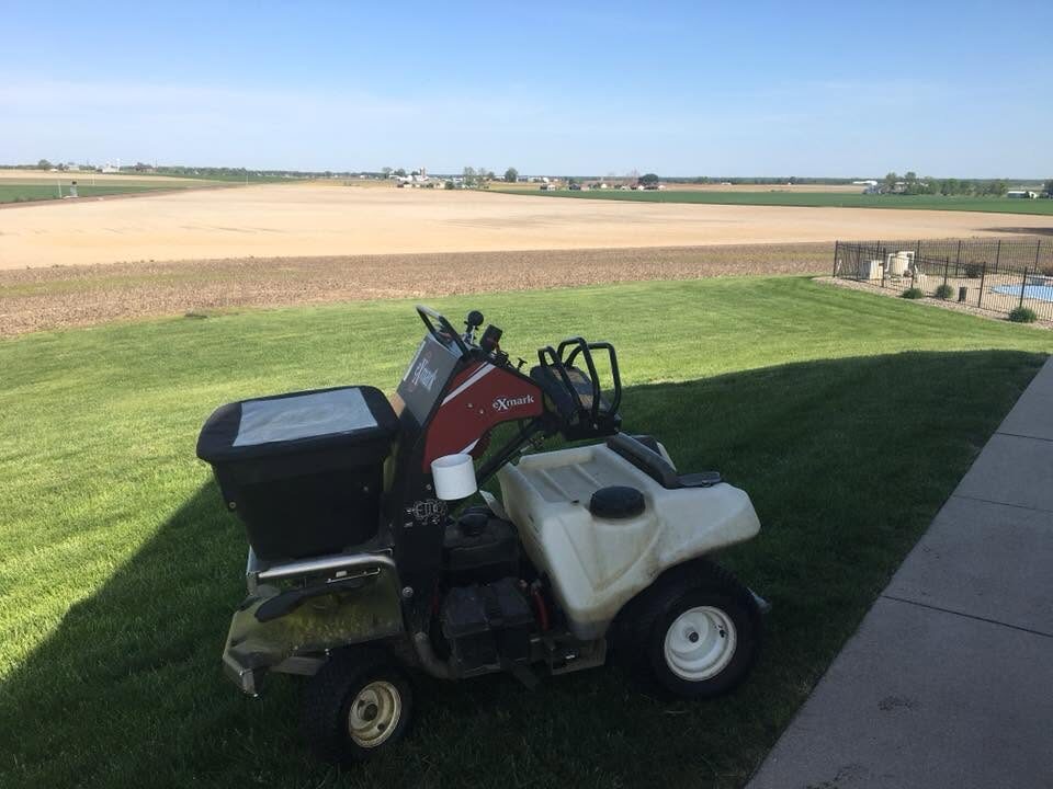 Mowing equipment on a freshly maintained lawn